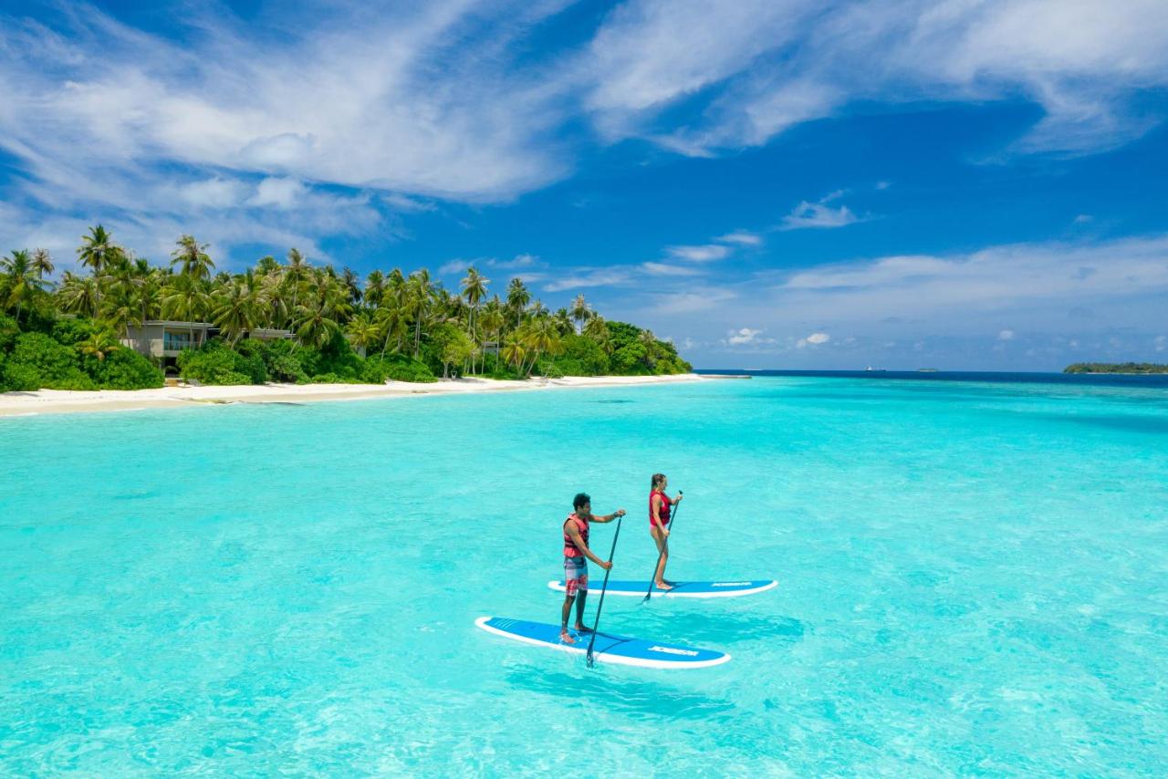 Amilla Maldives Resort and Residences - paddleboarding, águas turquesas no resort de luxo nas Ilhas Maldivas