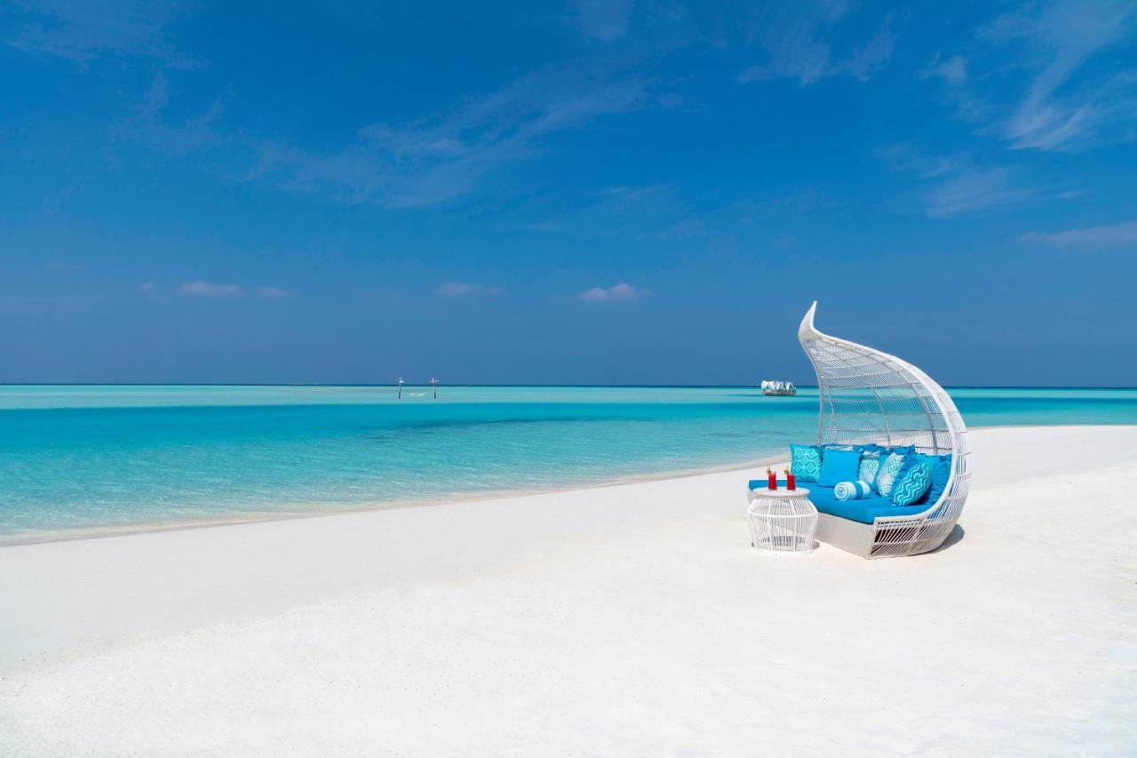 Anantara Dhigu Maldives Resort - cama de descanso, águas turquesa no resort de luxo nas Ilhas Maldivas