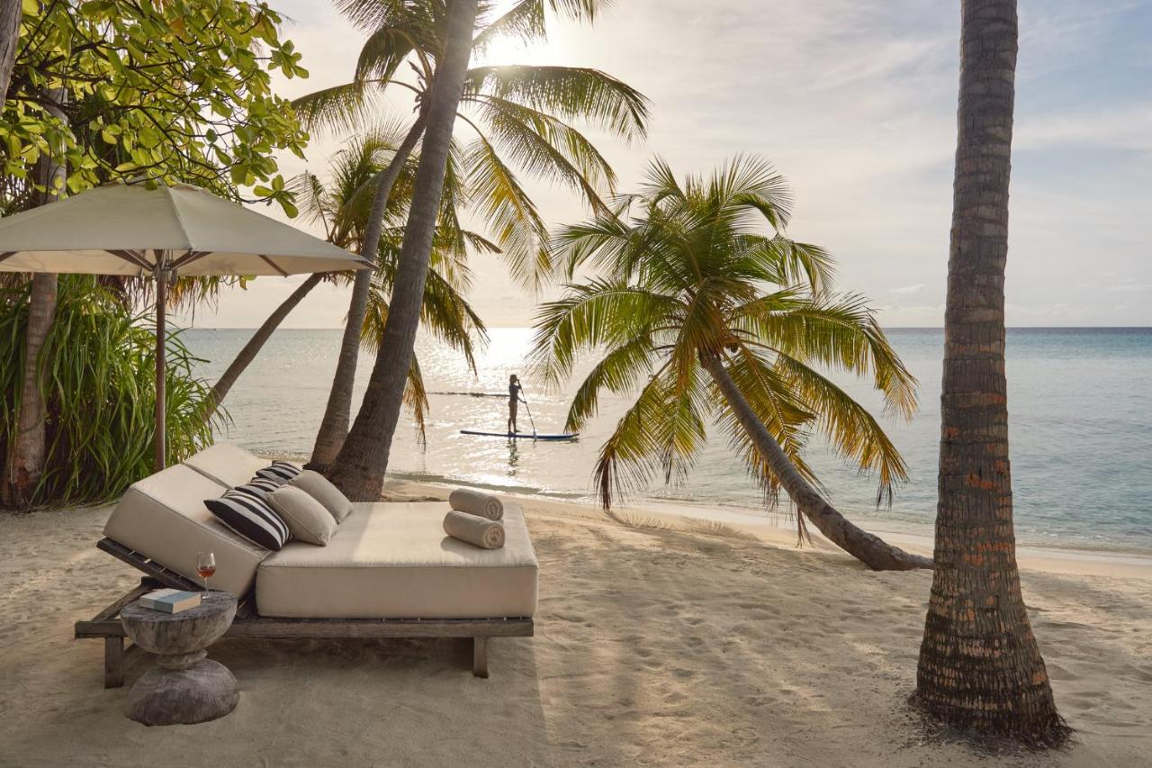 COMO Maalifushi - paddleboarding, área de descanso no resort de luxo nas Ilhas Maldivas