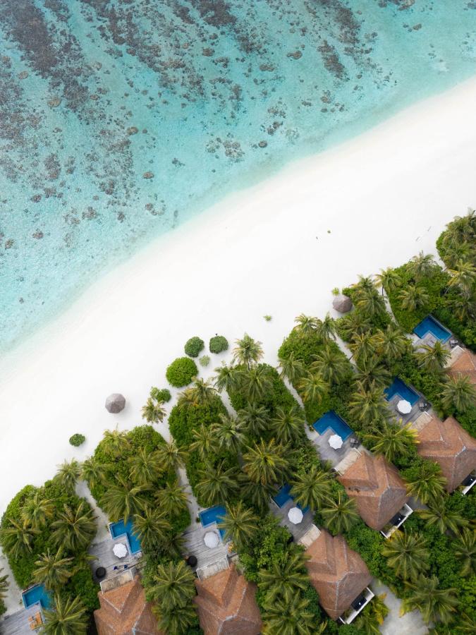 Radisson Blu Resort Maldives - vista aérea, vilas sobre a água no resort de luxo nas Ilhas Maldivas